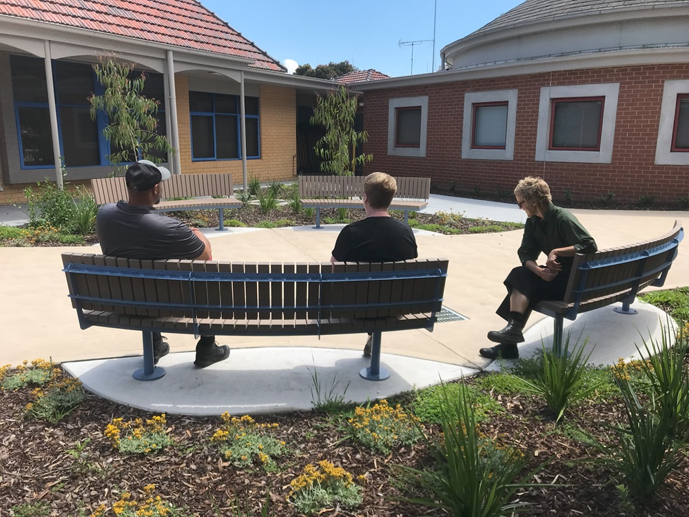 Veterans sitting outside the V Centre